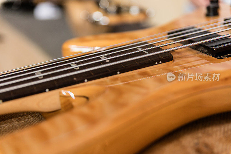 Detail of body of electric guitar at musician's studio